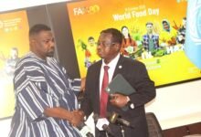 • Dr Abebe H. Gabriel interacting with Mr John Dumelo (left) at the launch of the World Food Day in Accra. Photo: Ebo Gorman