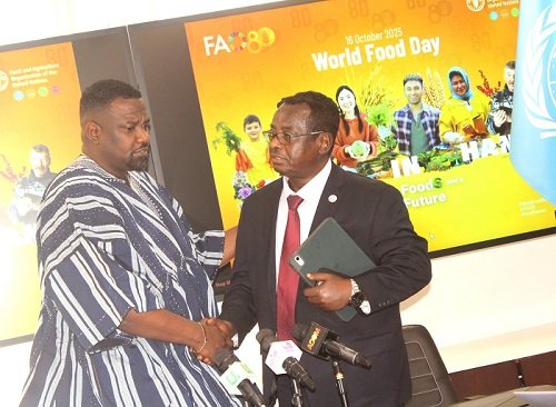 • Dr Abebe H. Gabriel interacting with Mr John Dumelo (left) at the launch of the World Food Day in Accra. Photo: Ebo Gorman
