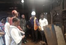 • Mr Saani Adams (third from right) being briefed by an operator at a workshop