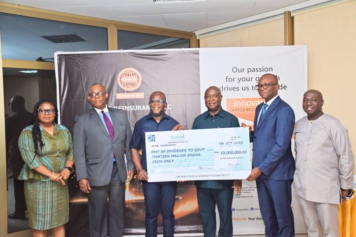 Mr. Aklasi (second from right) presenting the dummy cheque to Prof. Kpessa-Whyte (third from left)