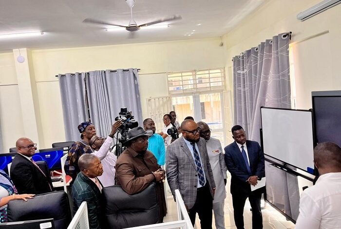 • Mr Adams Sukparu (middle) inspecting the newly commissioned centre