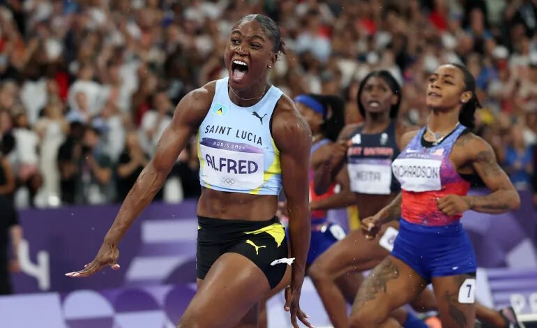 2024 Paris Olympic women's 100m champions Julien Alfred celebrates ahead of Sha'Carri Richardson and Melissa Jefferson