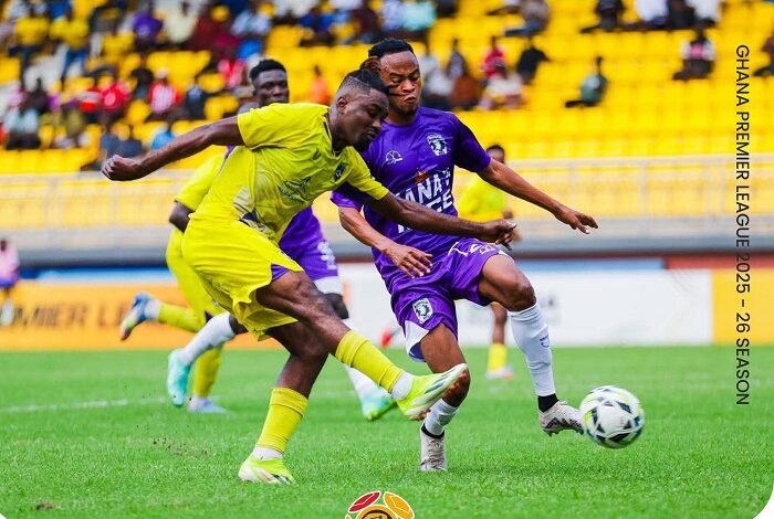 • A Medeama defender (in yellow) makes a timely clearance before the Bechem attacker causes havoc