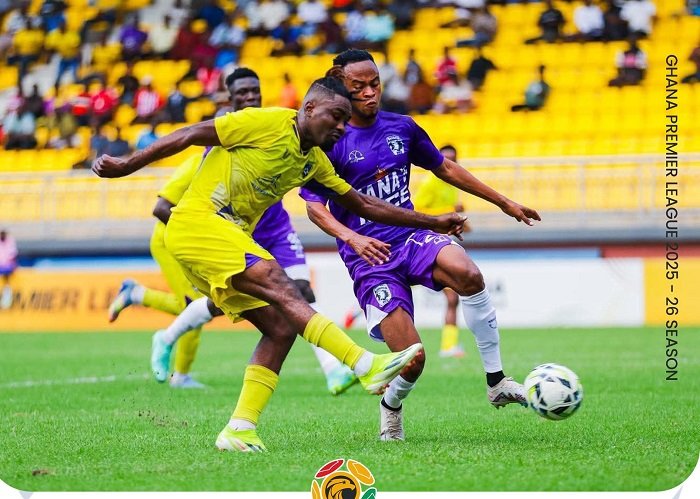 • A Medeama defender (in yellow) makes a timely clearance before the Bechem attacker causes havoc