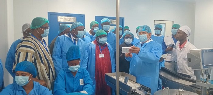 • Mr Tripathi (with a box in hand), explaining the production process to members of the Health Committee during the tour of the company