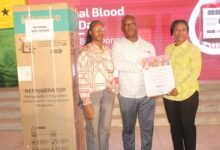 Mr Andrews Kwasi Siaw (middle) receiving the overall national best donor award from Dr Grace Ayensu Danquah (right) Photo: Ebo Gorman