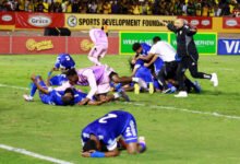 Curacao coach Dean Gorre and players celebrate after they qualify for the World Cup