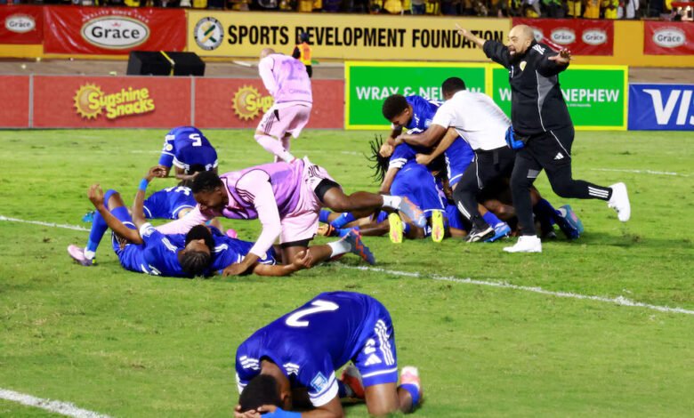 Curacao coach Dean Gorre and players celebrate after they qualify for the World Cup