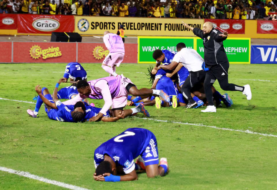 Curacao coach Dean Gorre and players celebrate after they qualify for the World Cup