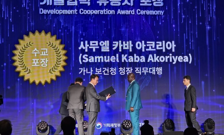 Dr Akoriyea(second right) receiving his award