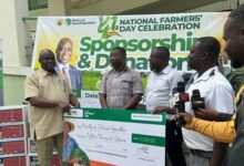 • Mr Opoku receiving a dummy cheque from RMG executives