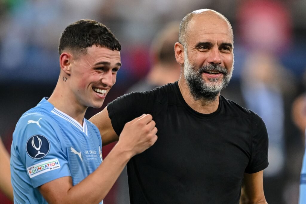 Foden with coach Guardiola