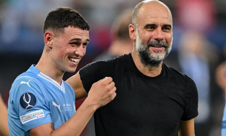 Foden with coach Guardiola