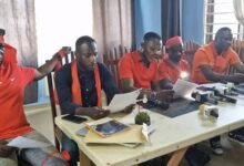 • Mr Alhassan Fusheini (in smock) answering questions before the Committee on Local Government and Rural Development • Mrs Madeira, Brazil Ambassador to Ghana • Gabriel Madobi Oklettey (third right) addressing the press. With him are other members of the group.