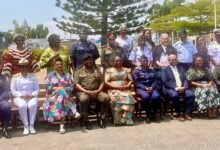 • Nana Oye Bampoe Addo (seated middle) with Lieutenant General William Agyapong (seated forth from left) and other dignitaries at the event