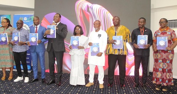 • Dr Joseph Whittal (sixth from right), Dr Alhassan Iddrisu (third from left) and other invited guests launching the report Photo: Ebo Gorman