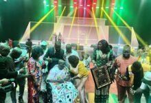 • Agya Koo Nimo (seated) receiving his award from Ms Abla Dzifa Gomashie (fourth from right)