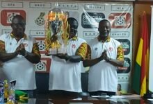 • Mr Akwaboah displaying the trophy
