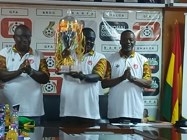 • Mr Akwaboah displaying the trophy