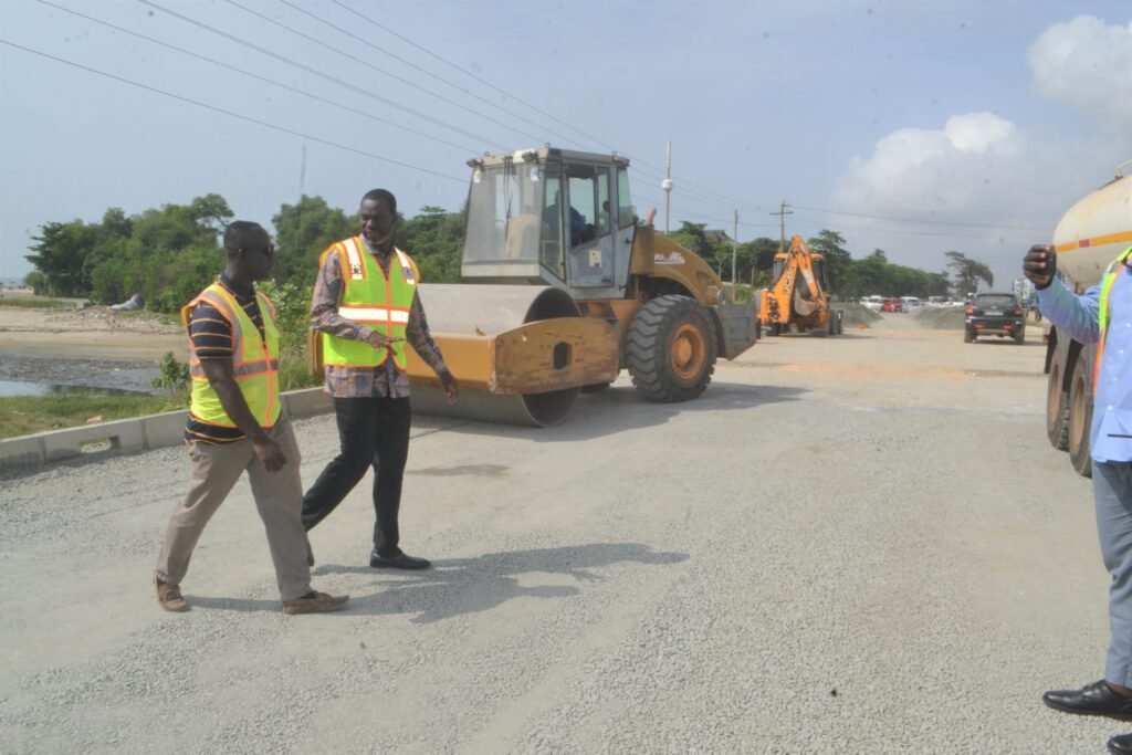 • Mr Anyetei (second from left) with Mr Rockson at the construction site Photo: Victor A. Buxton