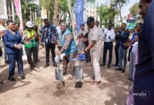 Mr Baiden being assisted by Mr Allotey-Gaisie to cut sod for the project