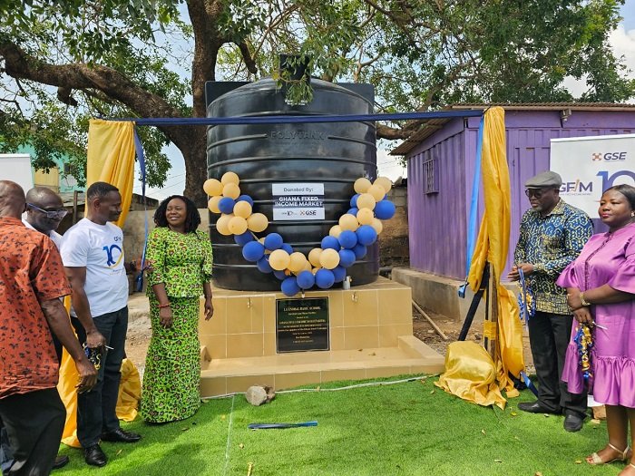• Mr Berle (second from left) with Ms Sowah (third from left) and other dignitaries after handing over the project