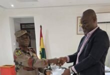 • ACFO II Isaac Saah (left) receiving a cheque from Mr Felix Odartey Lamptey