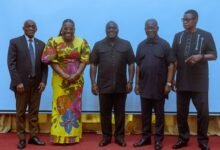 • Mr Julius Debrah (middle) with other government officials