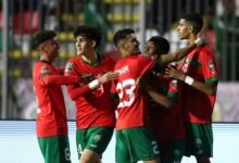 Moroccan players celebrating a goal in their last game