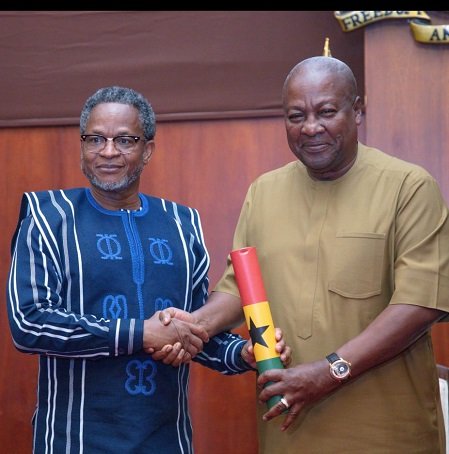 Mr Akibate receiving his instrument of commissioning from the President