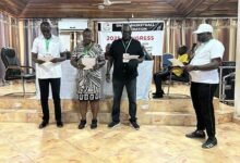 • Mr Baa-Mensah, (in cap) swearing in the newly elected executives, Mr Kukula (left) Madam Commodore-Toppar and Mr Ayitey Bulley