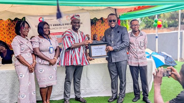 • Mr Prince Frimpong Kumi (middle) receiving the award from a representative from EduQuality