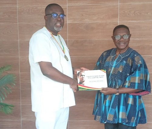 • Dr Asiedu (left) receiving the award from Dr Otibu-Asare