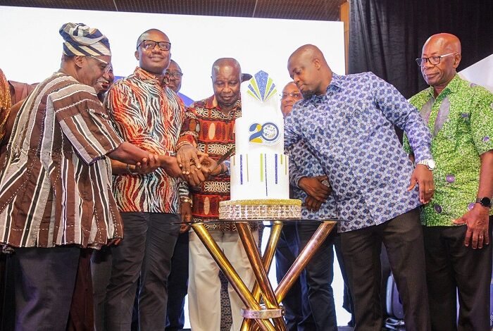 • Mr John Jinapor (second from left), Mr Tameklo (second from right), Mr Moses Asaga (in smock) and other dignitaries cutting the anniversary cake Photo: Ebo Gorma