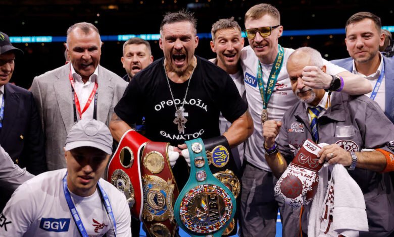 Oleksandr Usyk celebrates winning his fight against Daniel Dubois