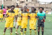 • Players of Parin FC join Aryetey to celebrating the win