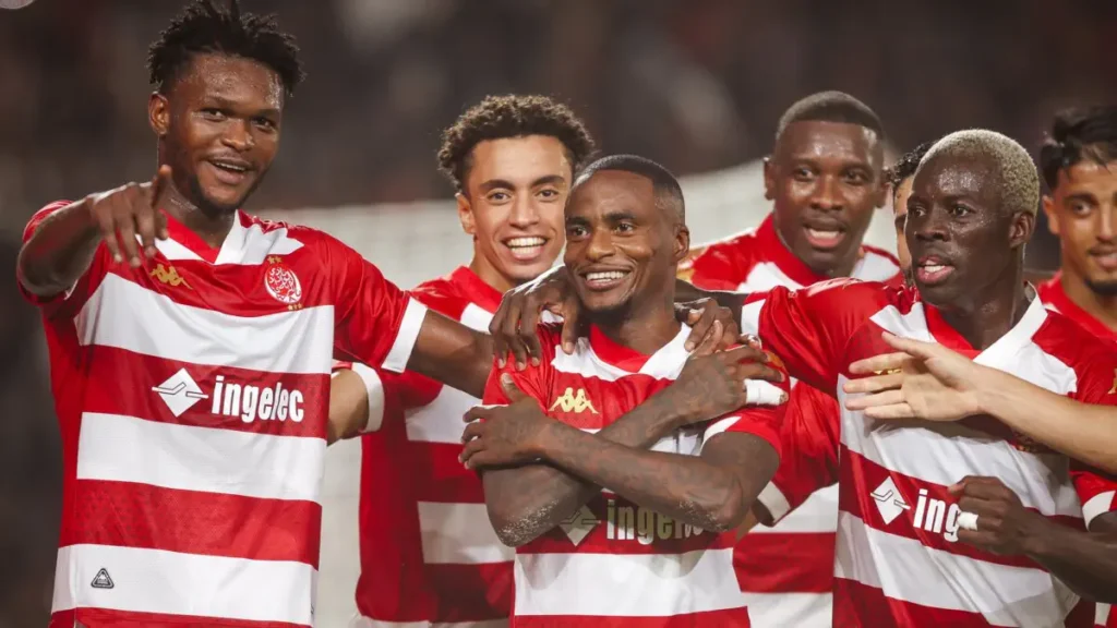 Players of Wydad Casablanca celebrating their qualification over Kotoko to make the group stages
