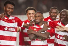 Players of Wydad Casablanca celebrating their qualification over Kotoko to make the group stages