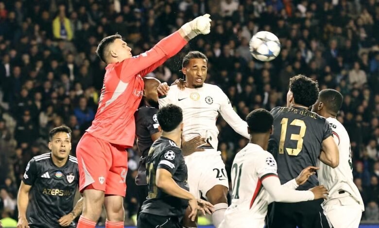 Qarabag's Mateusz Kochalski in action with Chelsea's Joao Pedro