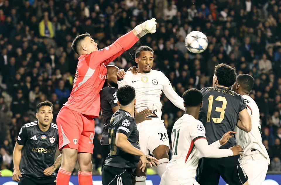 Qarabag's Mateusz Kochalski in action with Chelsea's Joao Pedro