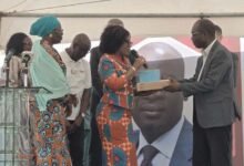 • Lydia Essuah presenting the B-STEM items to Prof. Davis