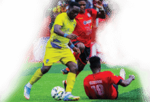 • Salim of Medeama controls the ball away from the Hohoe United markers