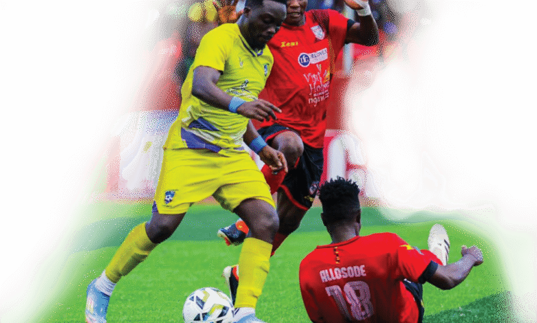 • Salim of Medeama controls the ball away from the Hohoe United markers