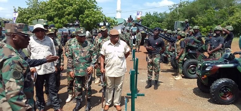 Mr Genfi (second from left)being briefed on the use of some of the weapons
