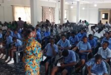 Mrs Kpe addressing the boys in a workshop at Adidome