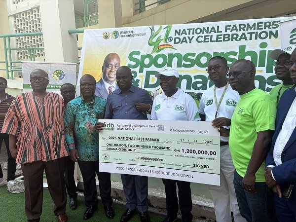 Mr Opoku (third from left) receiving a dummy cheque from representative from ADB