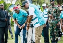 A focused President Mahama meticulously eyes the line to the hole before hitting the ball