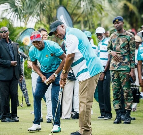 A focused President Mahama meticulously eyes the line to the hole before hitting the ball