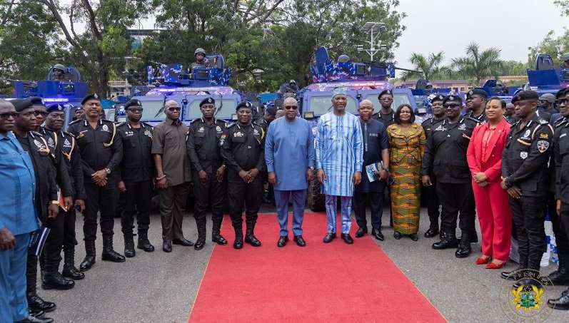 President Mahama (middle) with Alhaji Muntaka Mohammed-Mubarak and some senior police officers after the handing over of the armoured vehicles