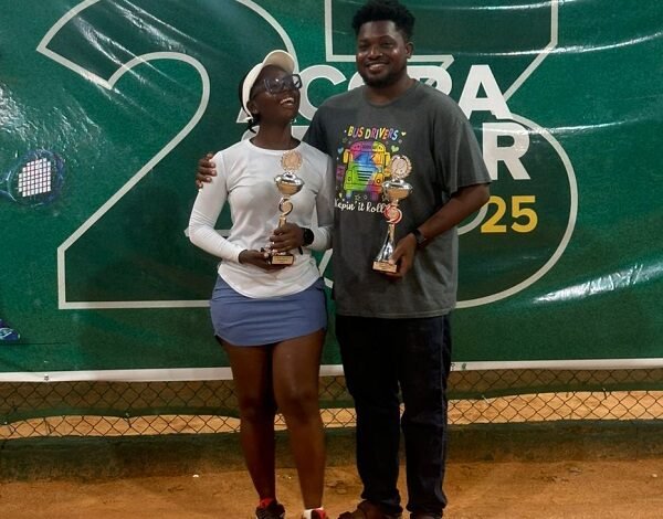 Abena Henodzi and Alex Kumah with their trophies after winning the mixed doubles event